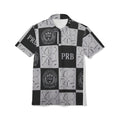 PRB Checkerboard Logo Polo Shirt — PRB Monogram All-Over Print by Printify